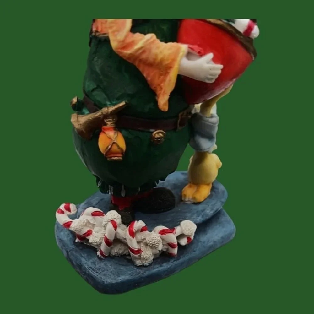 Santa claus figurine with gift and duck